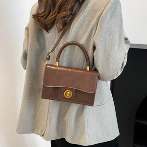 Vintage brown PU leather crossbody bag with golden round lock and metal top handle for women