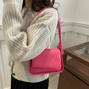 French style rose pink crossbody bag with woven texture and knotted strap detail