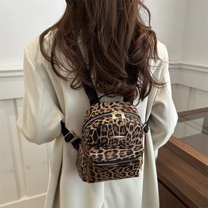 Stylish mini leopard print backpack for women with golden zippers and adjustable straps