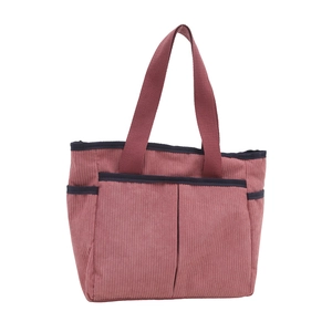 Pink corduroy large tote bag with contrast blue trim and front pockets for daily commute