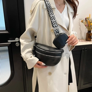 Women black leather waist bag with double zipper and geometric patterned wide strap