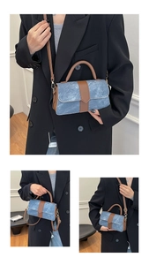 Detail of blue denim and brown leather crossbody bag showing dual carrying style