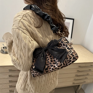 Leopard print baguette bag with black bow and pleated shoulder strap for women