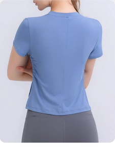 Rear view of sky blue moisture-wicking yoga top featuring side drawstring and back seam