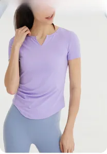 Detail of slim fit yoga t-shirt featuring side ruched waist and v-neckline design