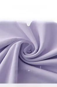 Close-up of lilac ribbed yoga fabric showing 86% polyester and 14% spandex blend texture