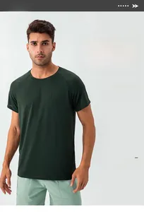 Detailed view of dark green quick-dry mesh fabric on a men's athletic t-shirt