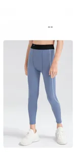 Detailed view of kids compression leggings with elastic waist and ergonomic seam lines