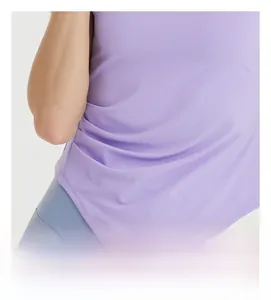 Detail of slimming side ruched design on a purple quick-dry athletic yoga t-shirt