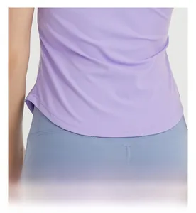 Detail shot of the curved hem design on a purple quick-dry slim fit yoga t-shirt