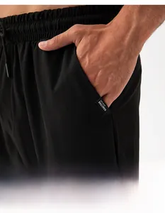 Detail of men's quick-dry sports trousers featuring side pockets and GOACTIVE woven label
