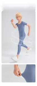 Close-up showing high-stretch knit texture and flatlock seams of boys compression pants