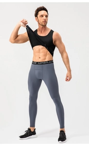 Close-up of men's compression leggings with UPGRADE elastic waistband for athletic training