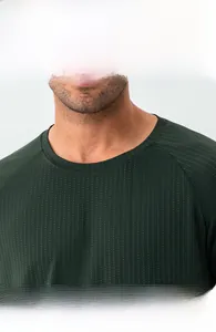 Close-up of dark green quick-dry athletic tee with durable elastic ribbed crew neck