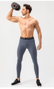 Macro detail of men's high elastic compression pants showing the Upgrade waistband
