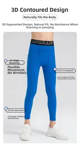 Detail of royal blue youth sports tights with UPGRADE lettering on elastic waistband