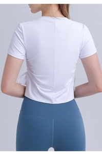 Detail view of white quick-dry sports top with back stitching and side drawstring