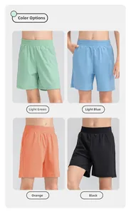 Quatre shorts de sport respirants pour enfants en vert clair, bleu, orange et noir séchage rapide