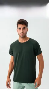 Detail of dark green men's athletic t-shirt showing breathable fabric and crew neck design