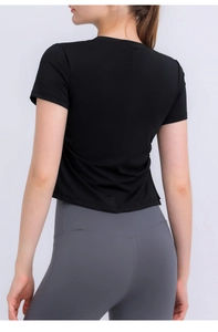 Back view of a black quick-dry yoga crop top with drawstring details for women