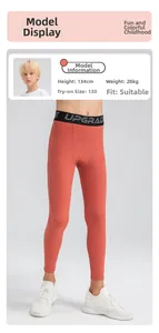 Détail du pantalon de sport orange pour garçon avec taille élastique noire Upgrade