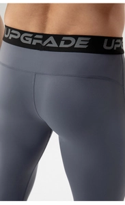 Detail of high-elastic waist with UPGRADE letter jacquard on men's compression pants