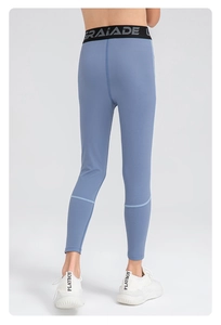 Back view of boys high-stretch athletic leggings with branded elastic waistband in blue