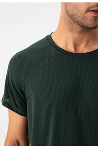 Close-up of crew neck and raglan sleeve detail on a breathable dark green sports t-shirt