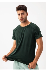 Macro detail of breathable dark green mesh fabric showing high elasticity and texture