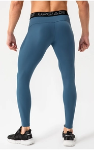 Close-up of gray-blue sports leggings showing high-elastic waist with UPGRADE text