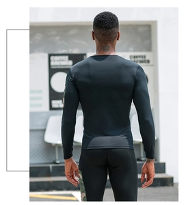 Rear view of men's compression sports set with camo side panels and tight muscle fit