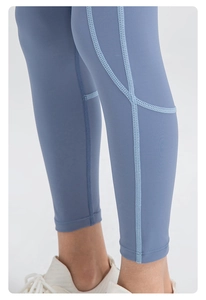 Detail of boys compression leggings featuring athletic blue seams and high elastic fabric