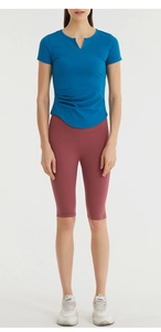Close-up of slim-fit yoga t-shirt with side ruched details and v-neckline for women