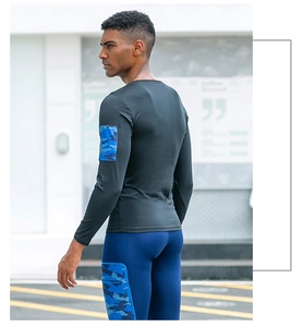 Men's athletic compression suit with blue camo pockets and quick-dry stretch fabric