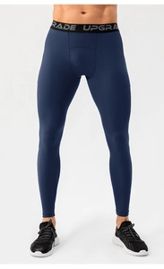 Detail of high-elastic waist with letters on navy blue men's compression pants