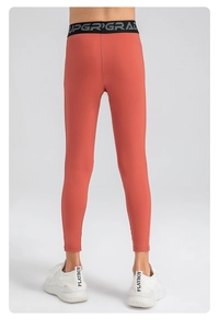 Détail du legging de sport corail pour garçon à séchage rapide avec ceinture élastique UPGRADE