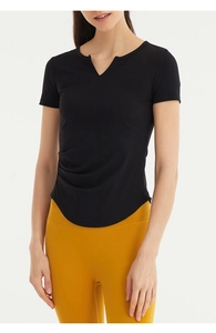 Detail of notch V-neckline and ruched side design on black slim-fit yoga t-shirt