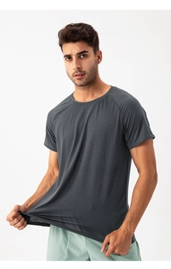Close-up of quick-dry gray sports t-shirt showing breathable mesh texture and stretch