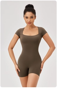 Front view of dark brown square neck short sleeve yoga romper with bodycon fit
