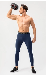 Detail of dark blue compression pants with UPGRADE waistband during dumbbell training