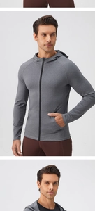 Close-up of raglan sleeves and gray heathered texture on men's zip-up sports jacket