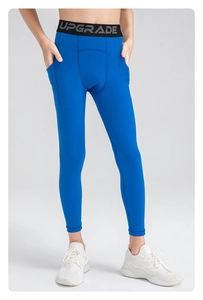 Detail of royal blue youth sports leggings featuring functional side pocket and elastic waist