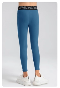 Vue arrière du legging de compression bleu pour garçon avec ceinture élastique lettrée UPGRADE