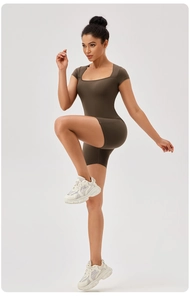 Detail of square neck brown ribbed bodysuit showing high stretch and slim fit athletic fabric