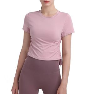 Pink quick-dry yoga crop top for women featuring side drawstring details and slim fit style