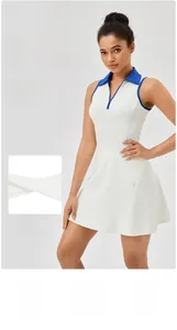 Detail showing the white tennis dress with four-way stretch fabric and a blue collar
