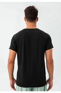 Detail of black men's sports t-shirt showing breathable mesh fabric and raglan sleeve design
