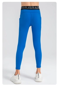 Detail view of high-waist royal blue sports leggings with side pocket and logo waistband
