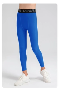 Detail of blue compression leggings with elastic waistband and UPGRADE lettering