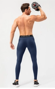 Macro shot of men's compression pants with wide logo elastic waistband and high-stretch fabric